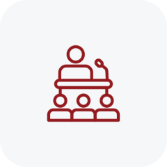 Red line icon of a podium with a microphone on top of it, set against a white background